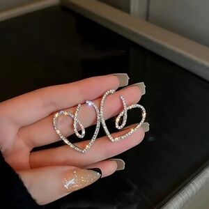 Gold Hoop Earrings with Heart Design and Elegant Finish